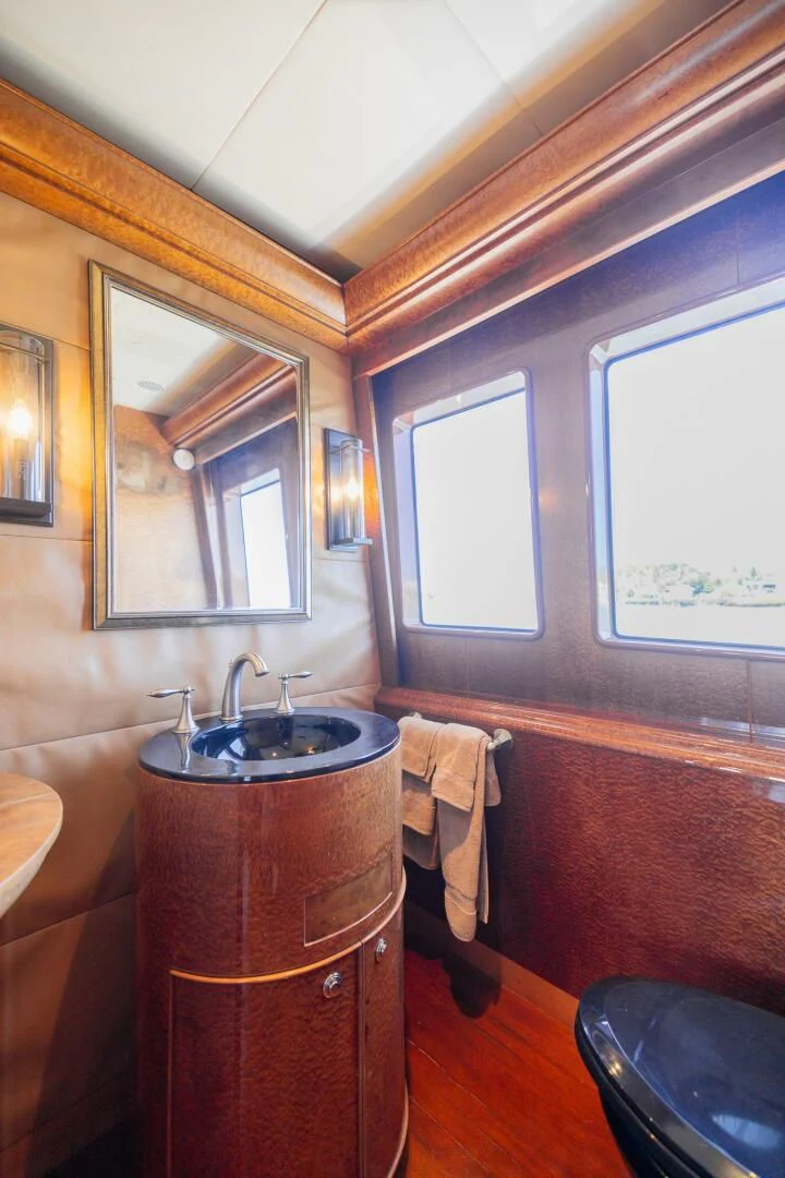 a bathroom with a sink and a mirror aboard PREDATOR I Yacht for Sale