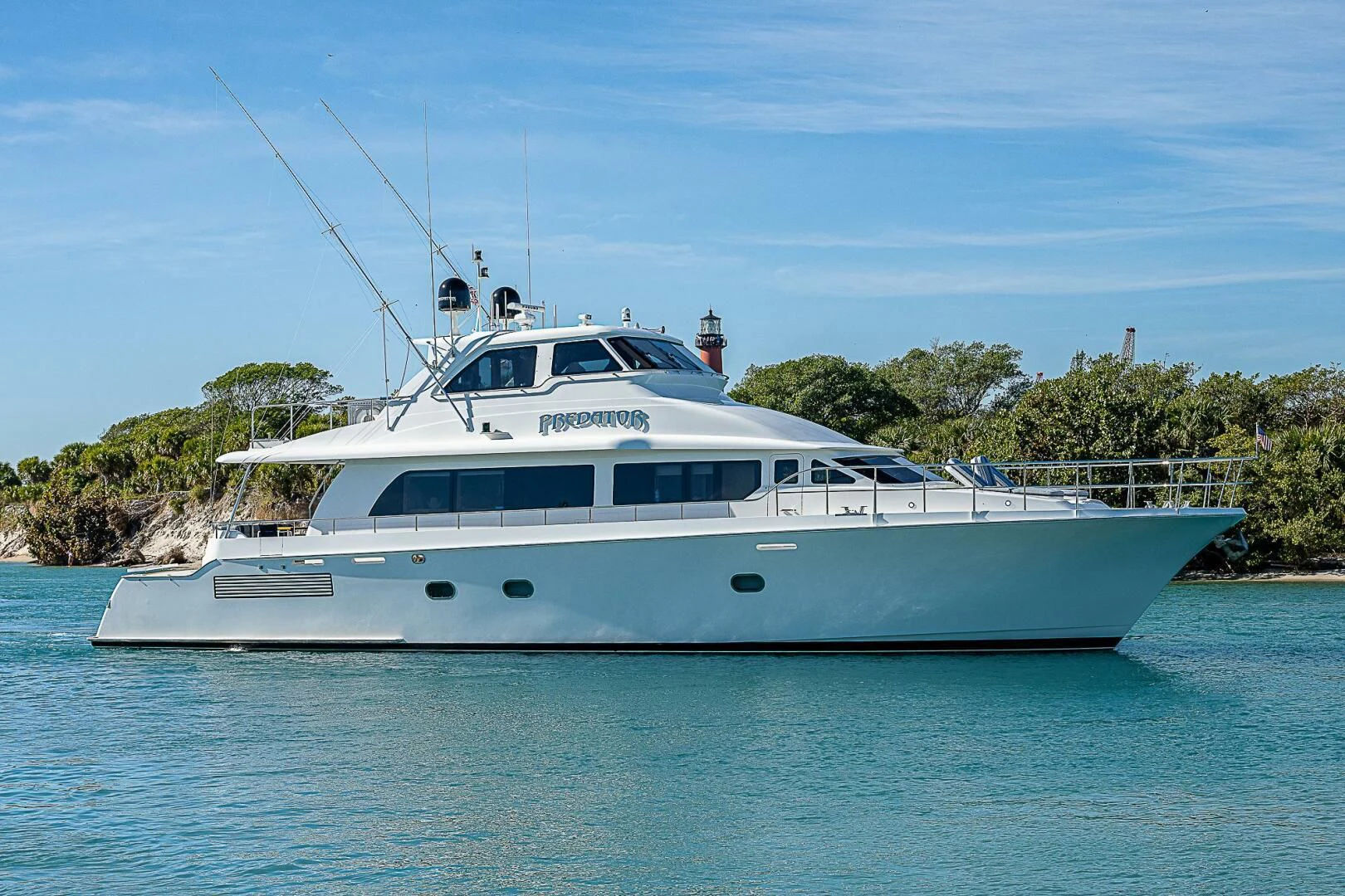 a white boat on water aboard PREDATOR I Yacht for Sale