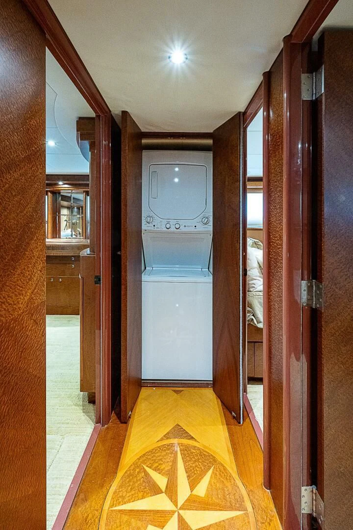 a bathroom with a yellow floor aboard PREDATOR I Yacht for Sale