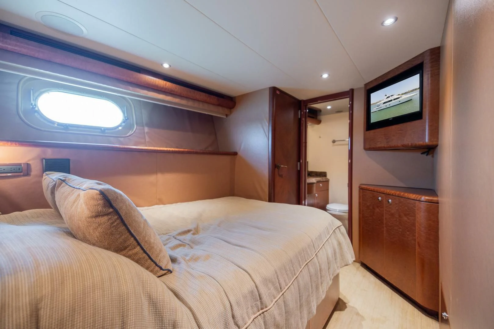 a bed in a room aboard PREDATOR I Yacht for Sale