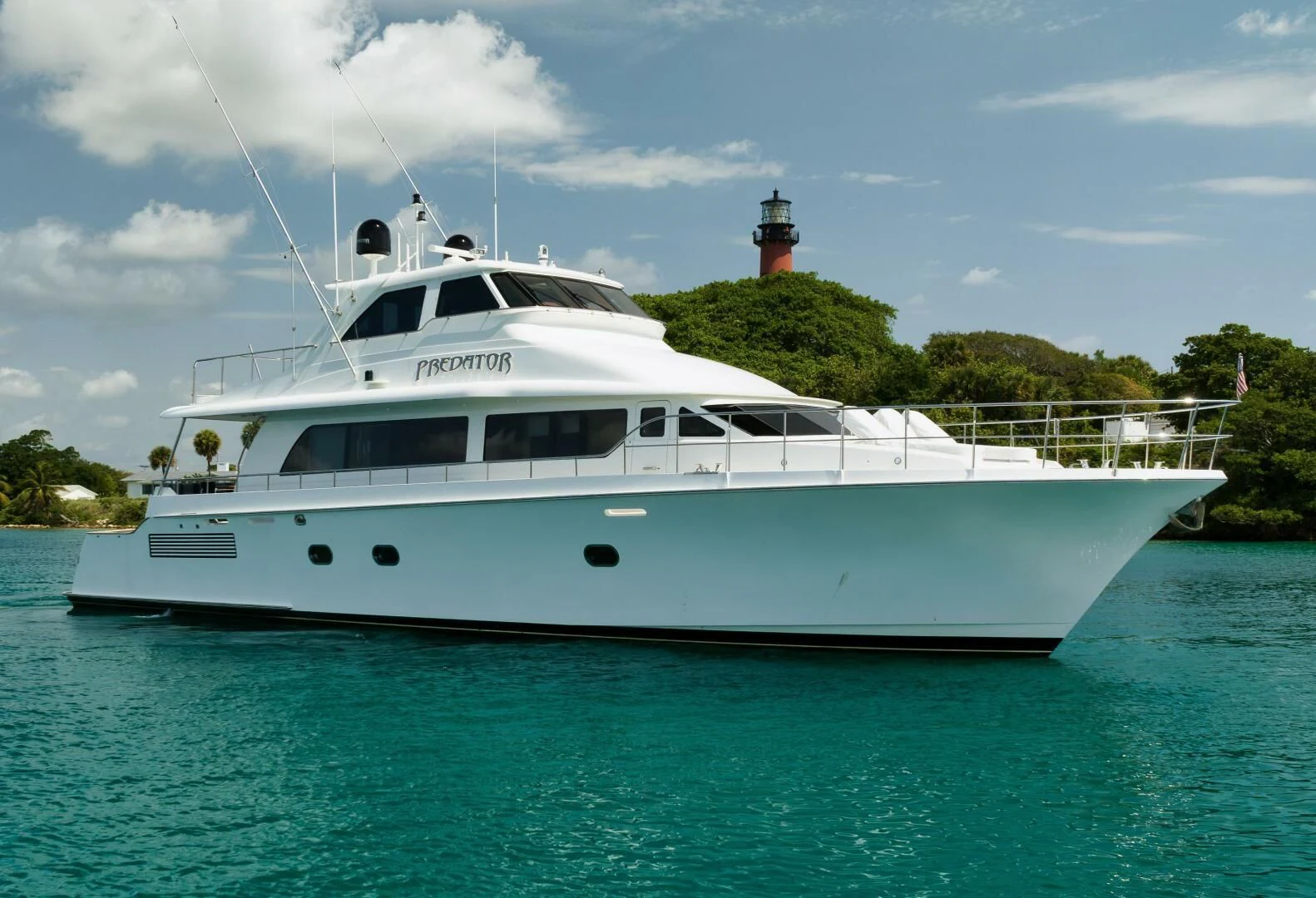 a white boat in the water aboard PREDATOR I Yacht for Sale