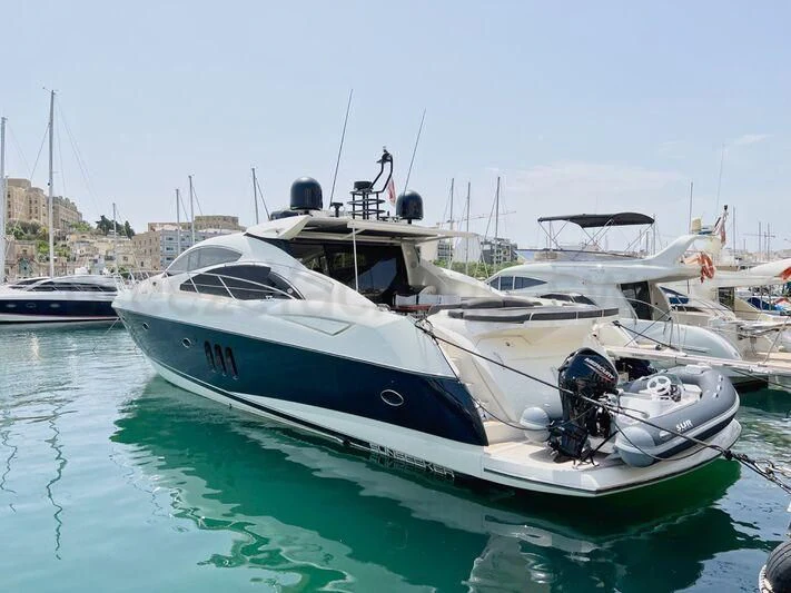 a boat docked in a harbor aboard PREDATOR I Yacht for Sale