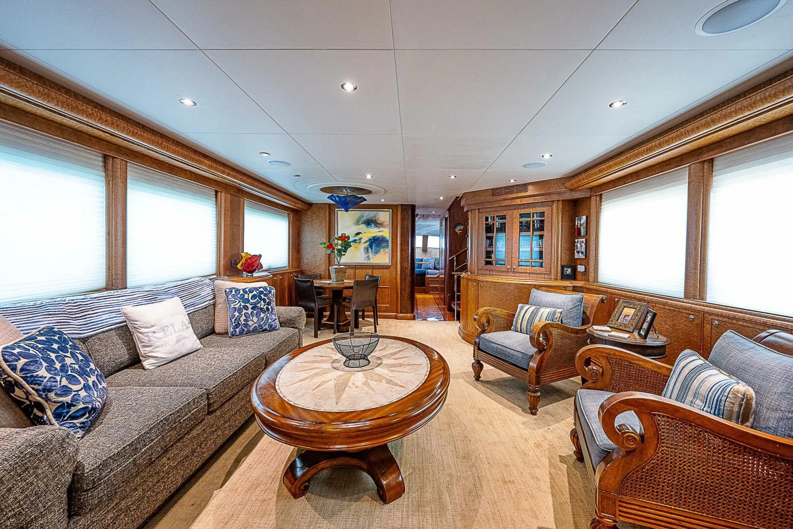 a living room with a couch and a coffee table aboard PREDATOR I Yacht for Sale