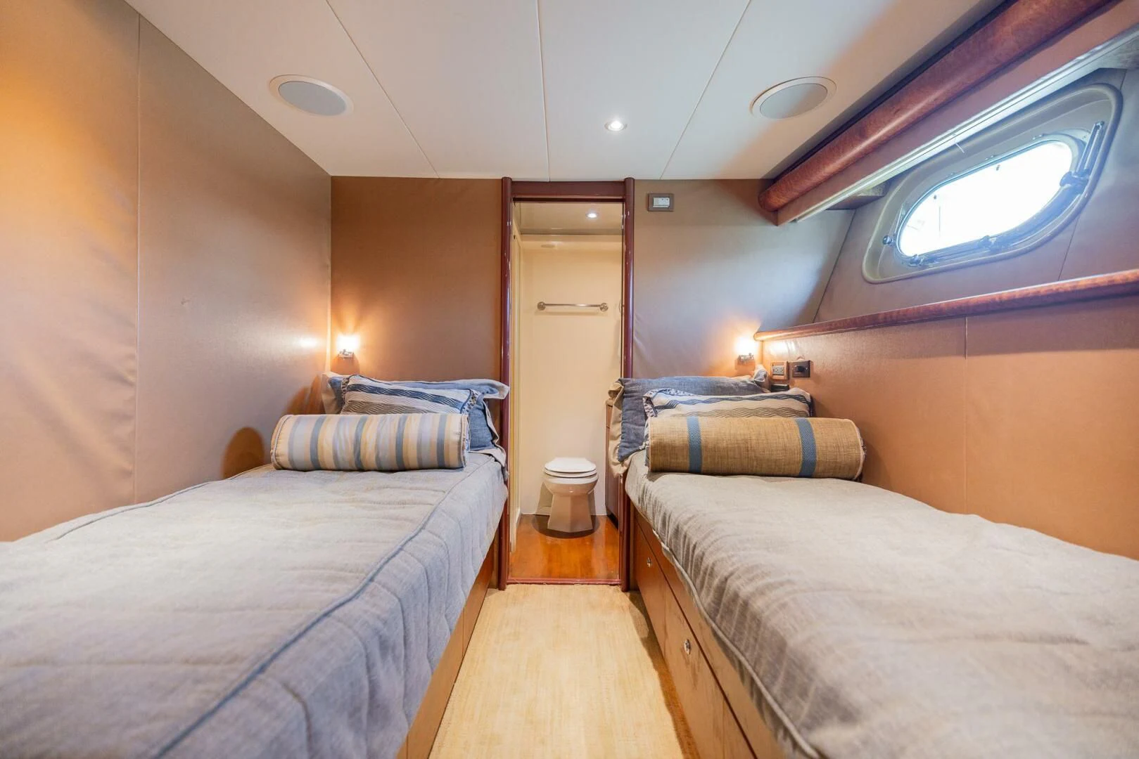 a room with two beds aboard PREDATOR I Yacht for Sale