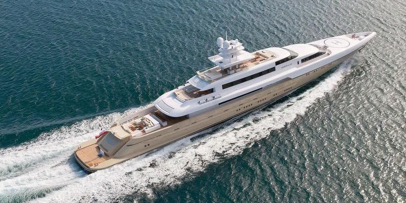 a white and black ship on a body of water aboard SMERALDA Yacht for Sale