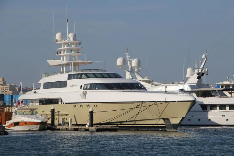 a large white boat in the water aboard SMERALDA Yacht for Sale