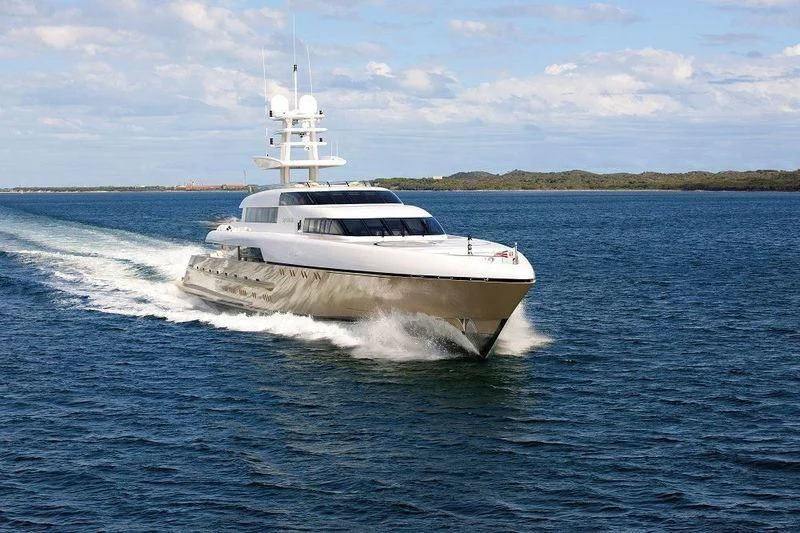 a white boat on water aboard SMERALDA Yacht for Sale