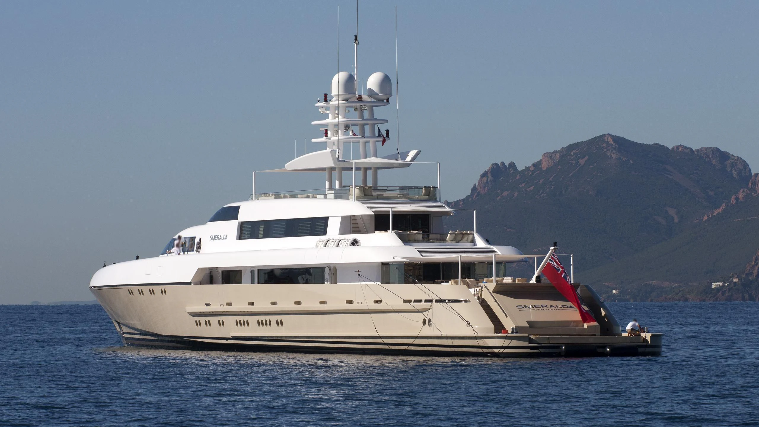 a large white yacht in the water aboard SMERALDA Yacht for Sale