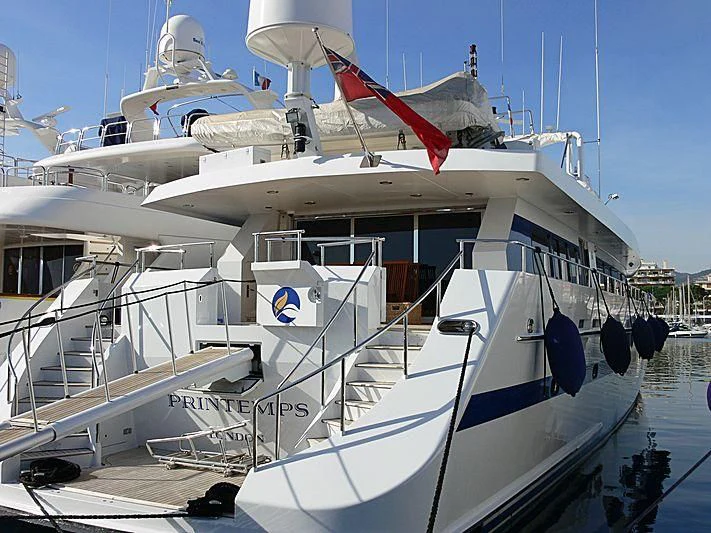 a large white boat with a flag on the front aboard ESRA Yacht for Sale
