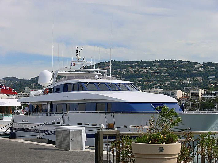 a large white boat docked aboard ESRA Yacht for Sale