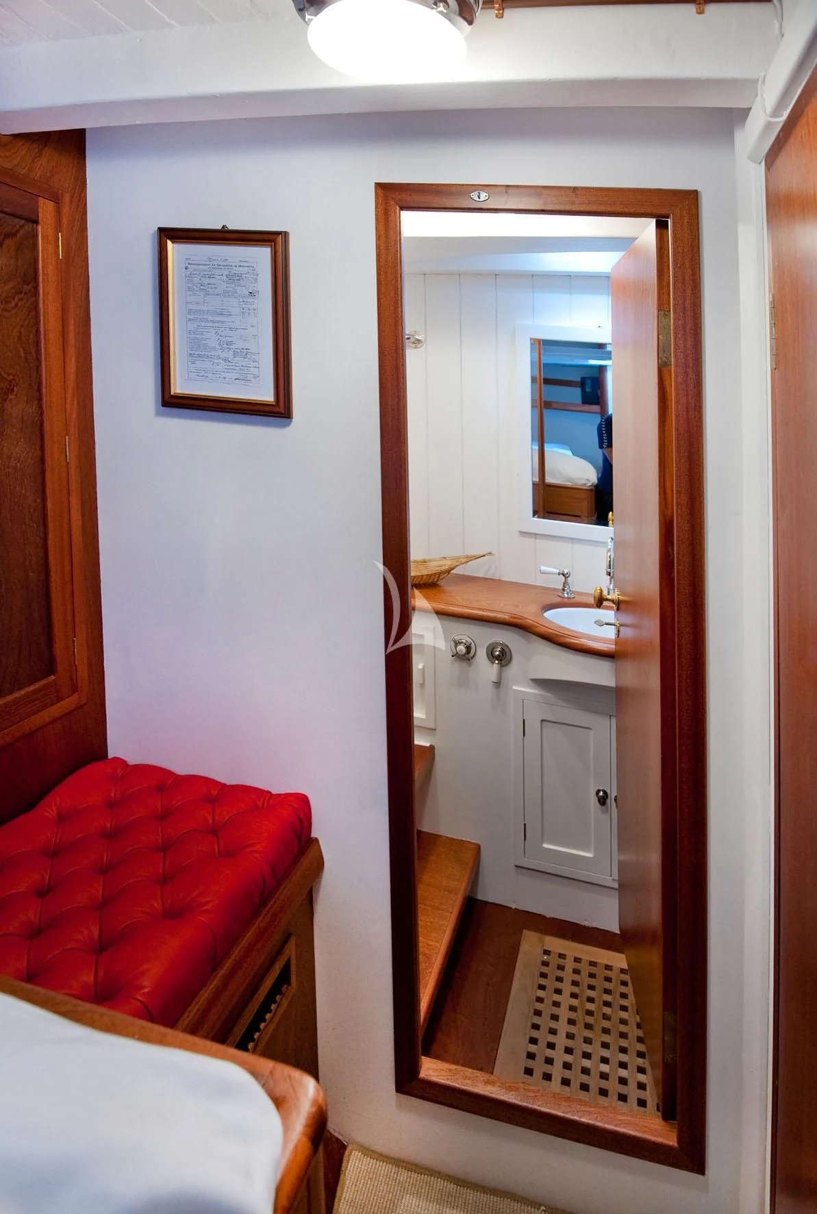 a bathroom with a sink and a mirror aboard ORIANDA Yacht for Charter