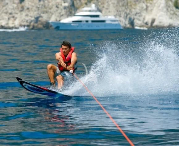 a man water skiing aboard ORIANDA Yacht for Charter