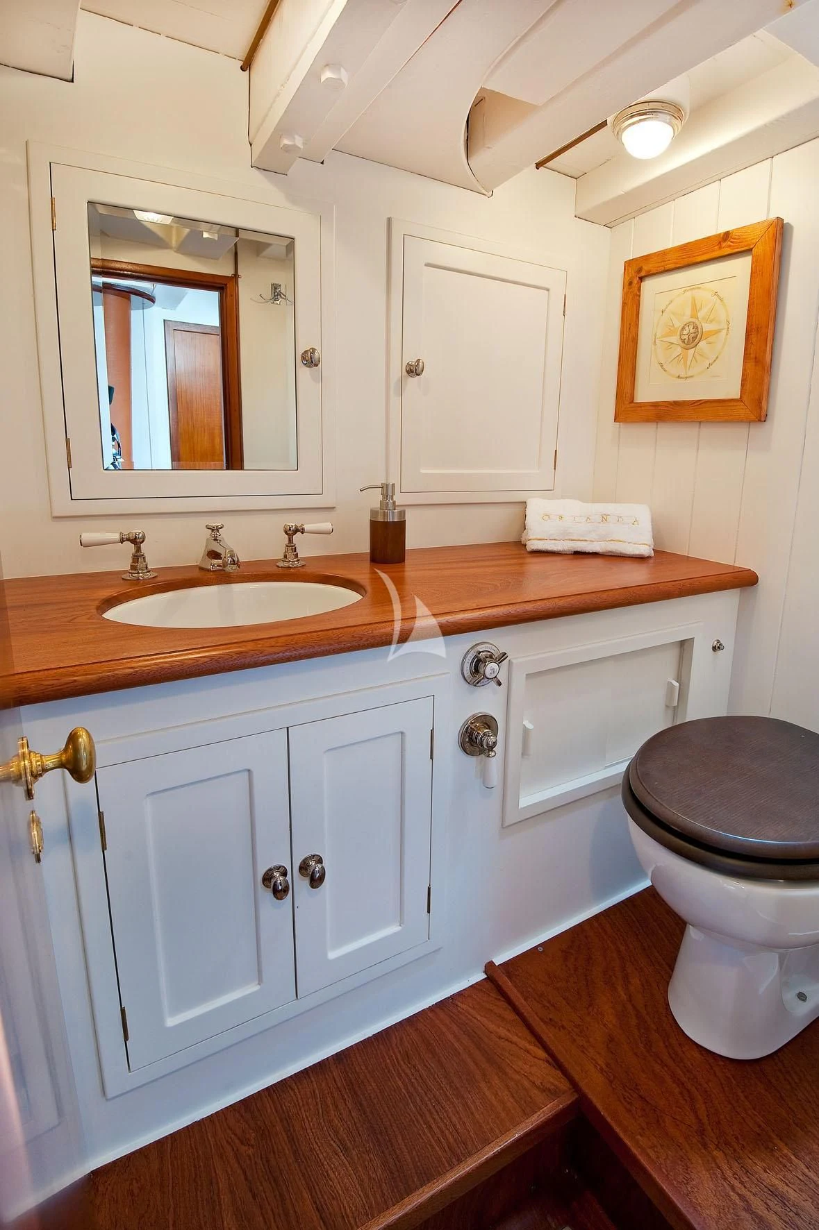 a bathroom with a sink and toilet aboard ORIANDA Yacht for Charter