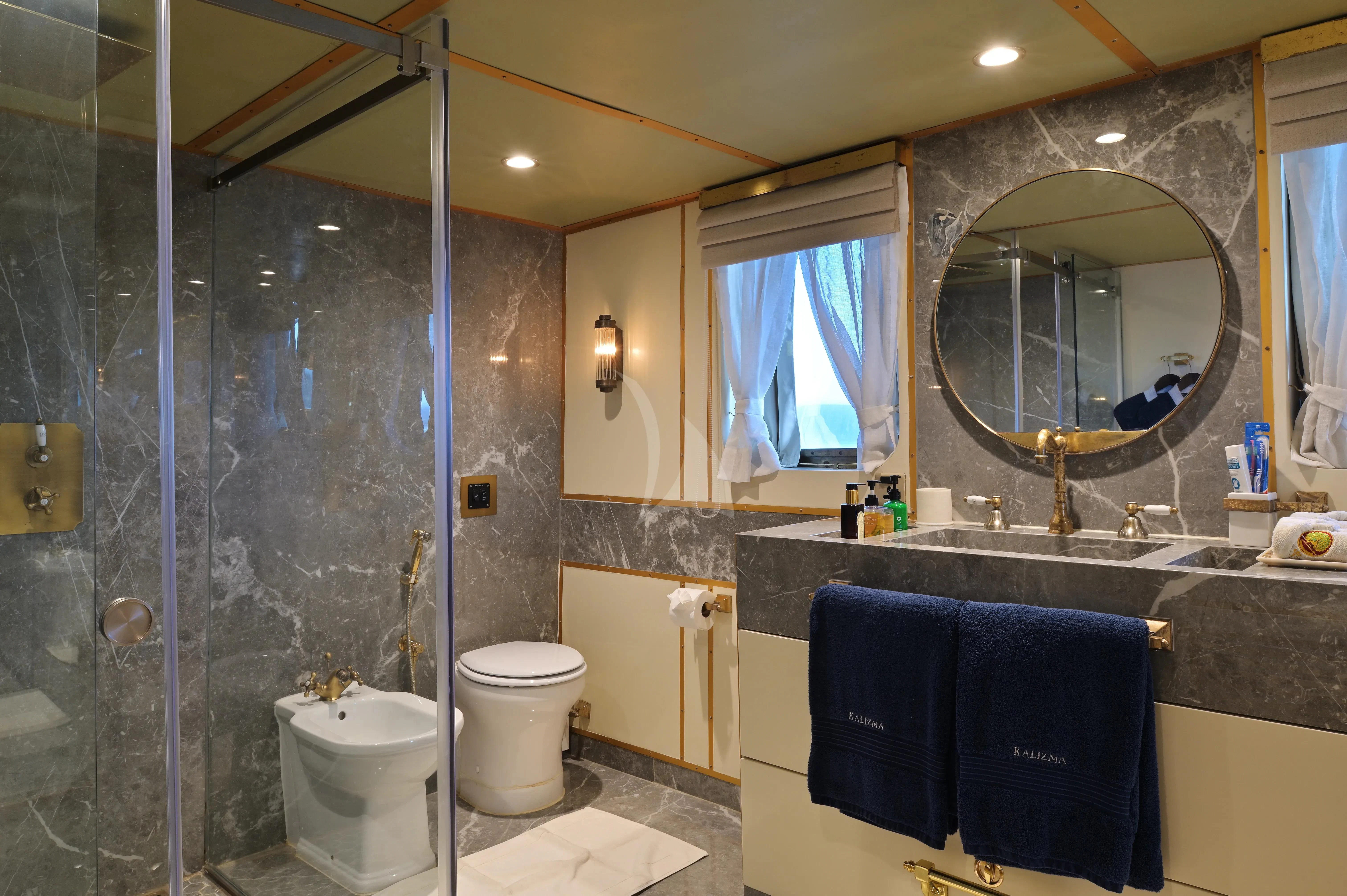 a bathroom with a glass shower aboard KALIZMA Yacht for Sale