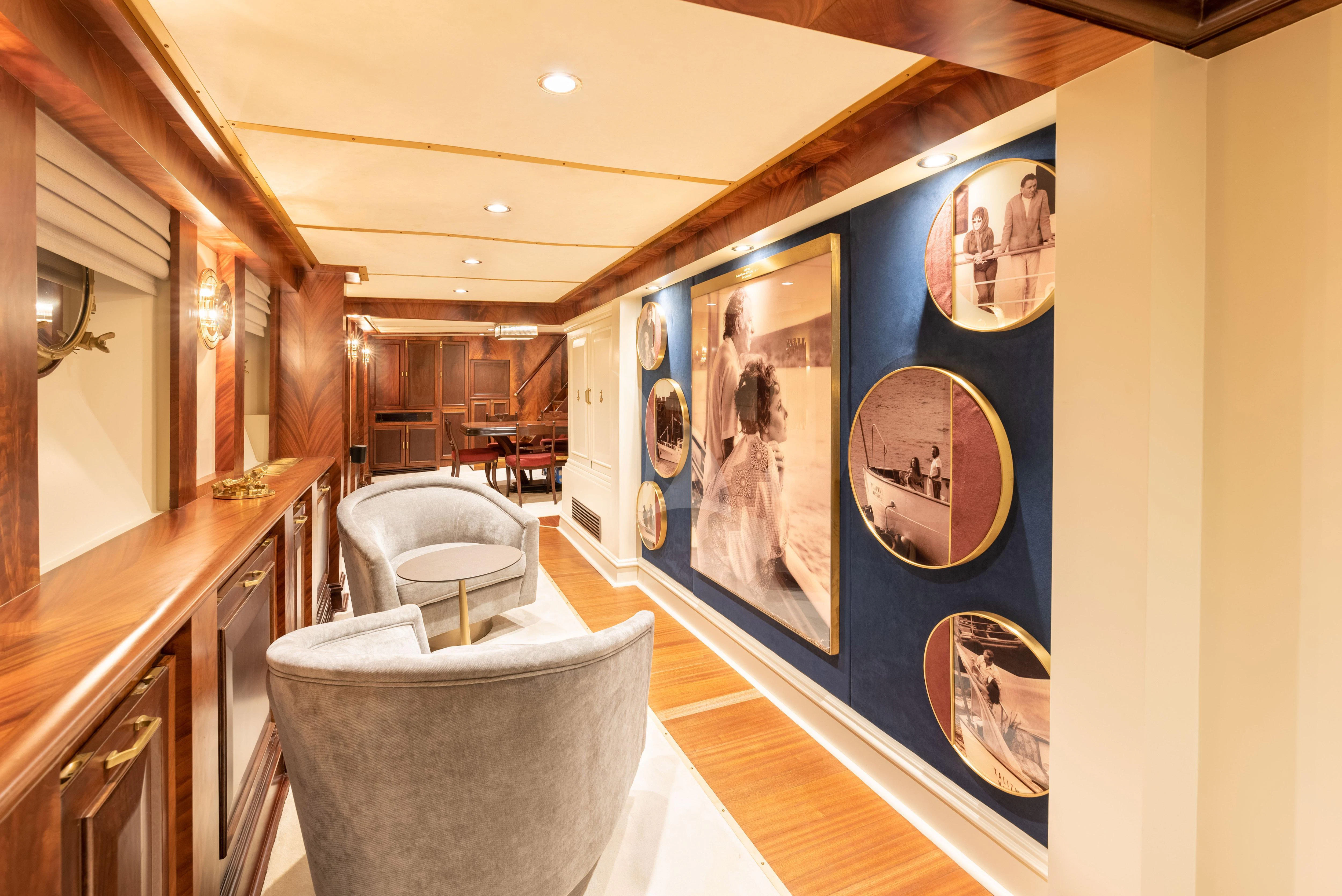 a room with a blue wall and a painting on the wall aboard KALIZMA Yacht for Sale