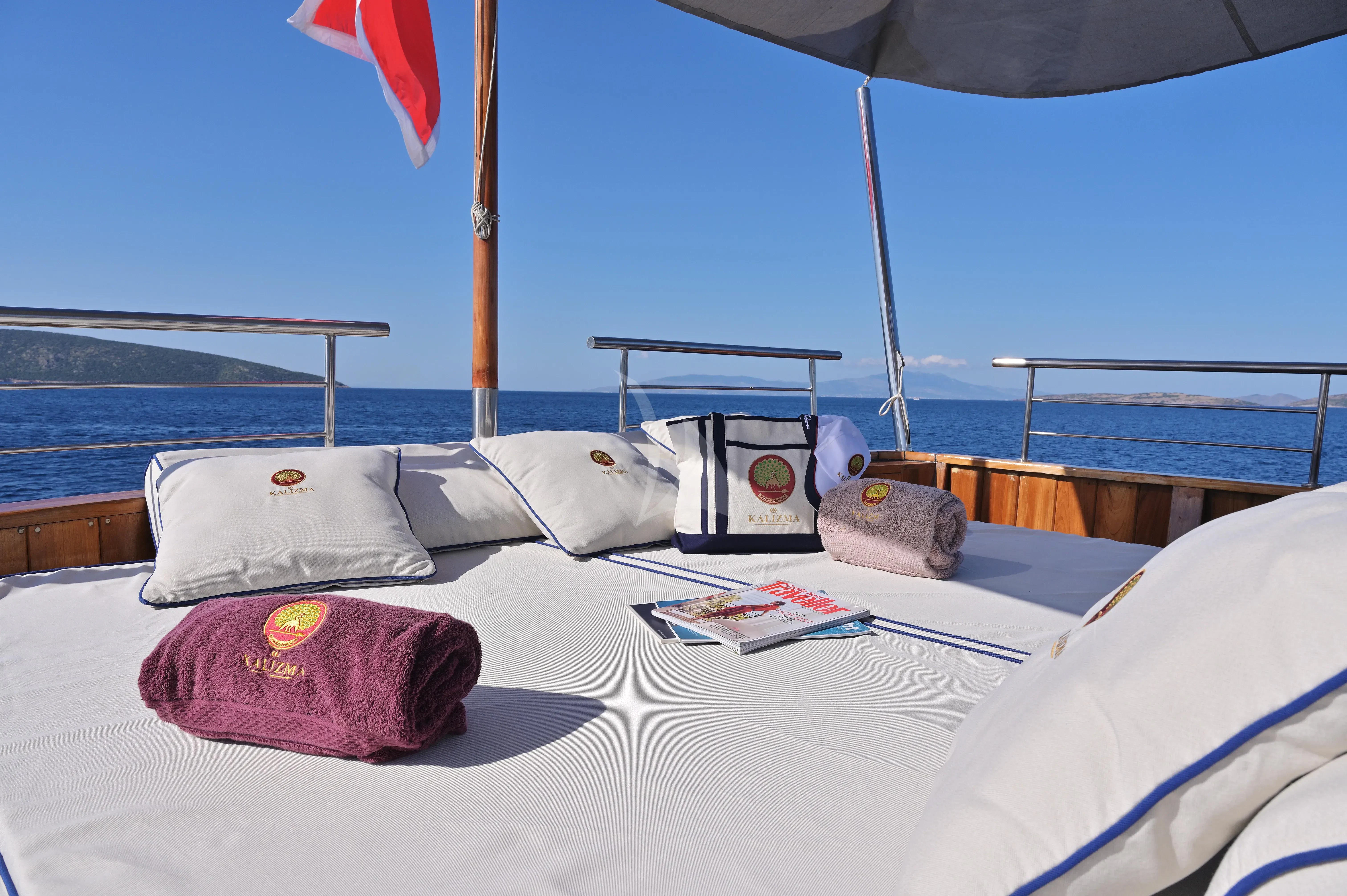 a bed with pillows and pillows aboard KALIZMA Yacht for Sale