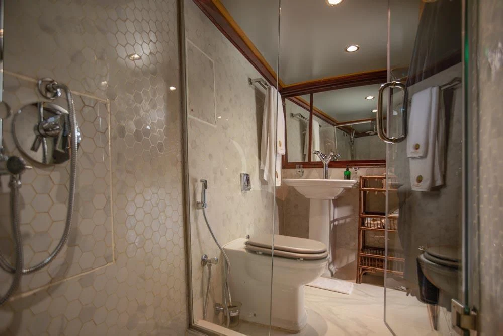 a bathroom with a glass shower aboard KALIZMA Yacht for Sale