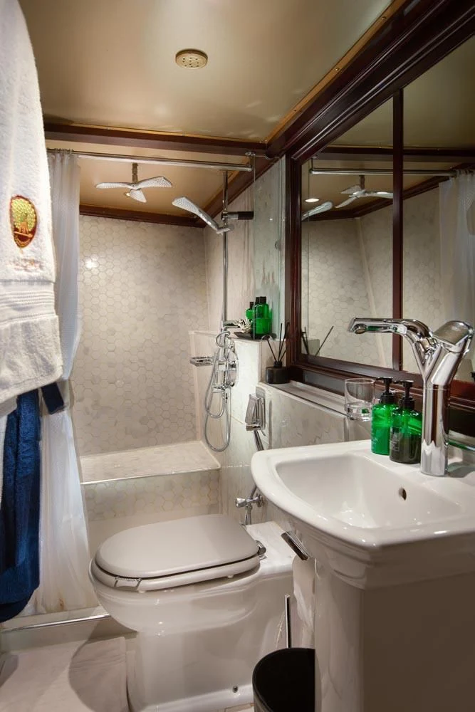 a bathroom with a toilet sink and a bathtub aboard KALIZMA Yacht for Sale