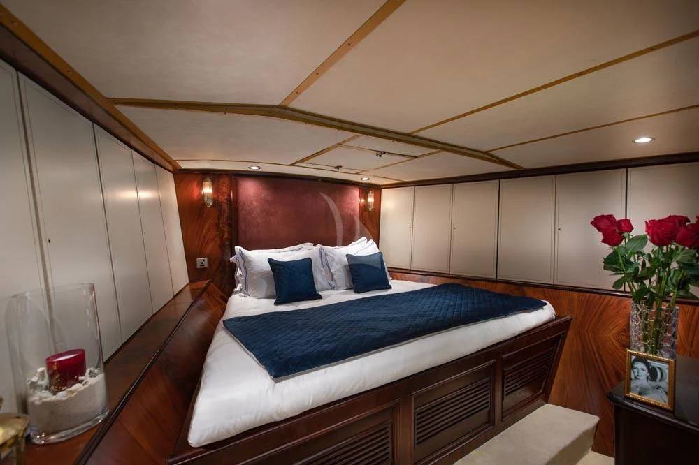 a bed in a room aboard KALIZMA Yacht for Sale