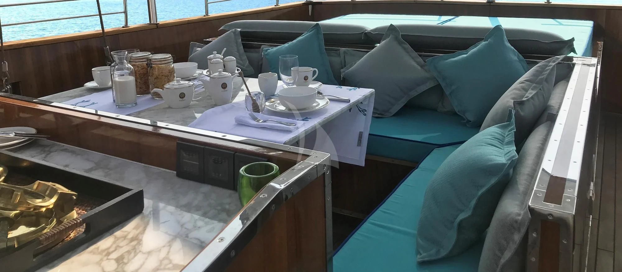 a room with a bed and a table with food on it aboard KALIZMA Yacht for Sale