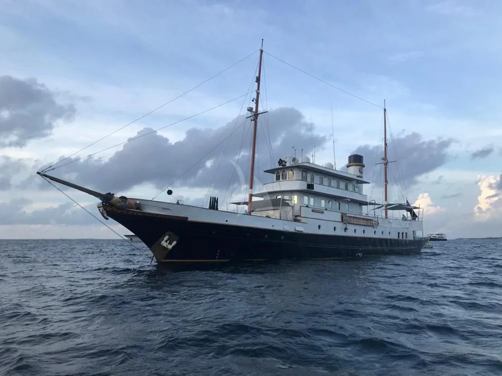 a large fishing boat in the water aboard KALIZMA Yacht for Sale