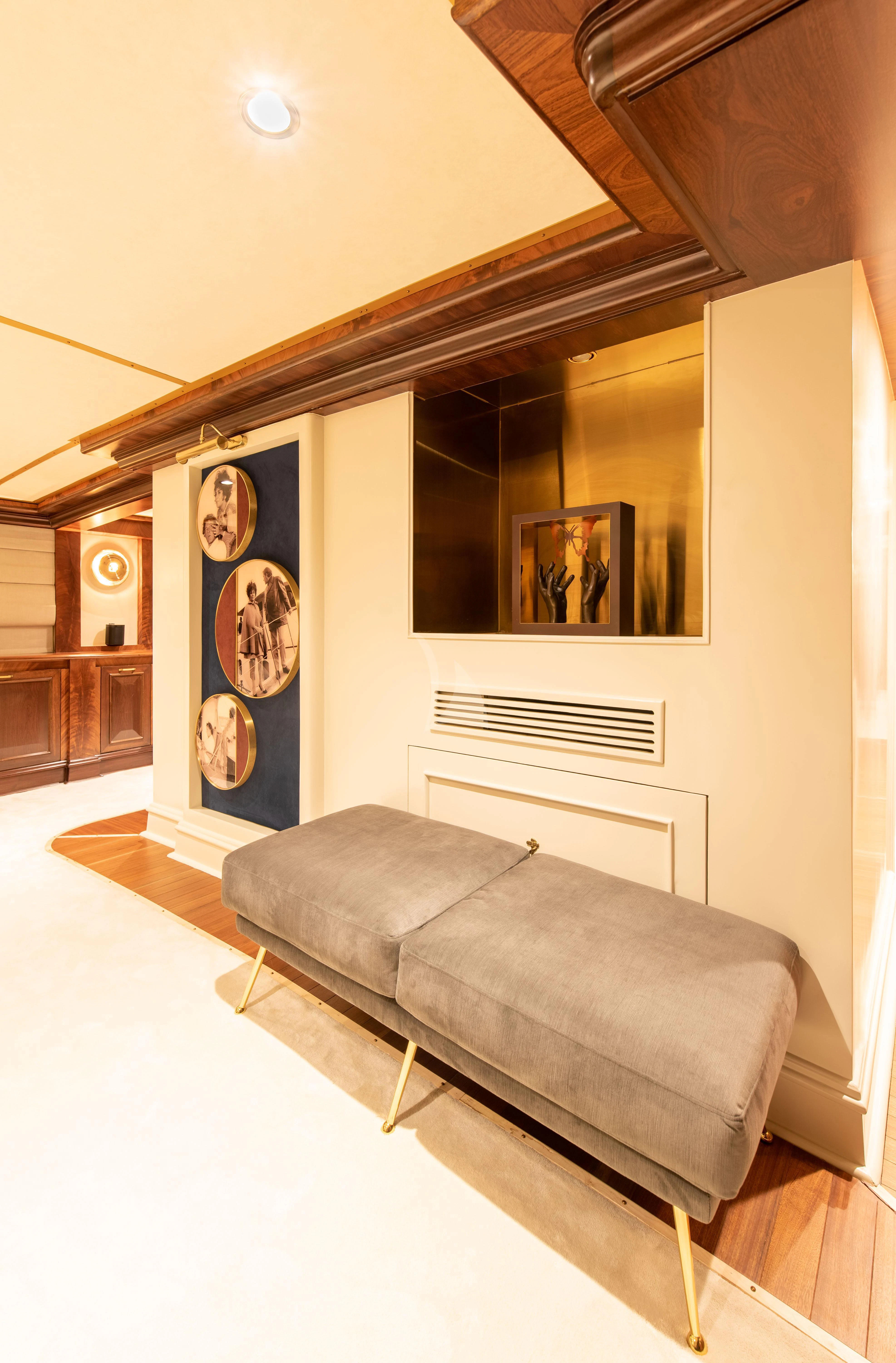 a living room with a large mirror aboard KALIZMA Yacht for Sale