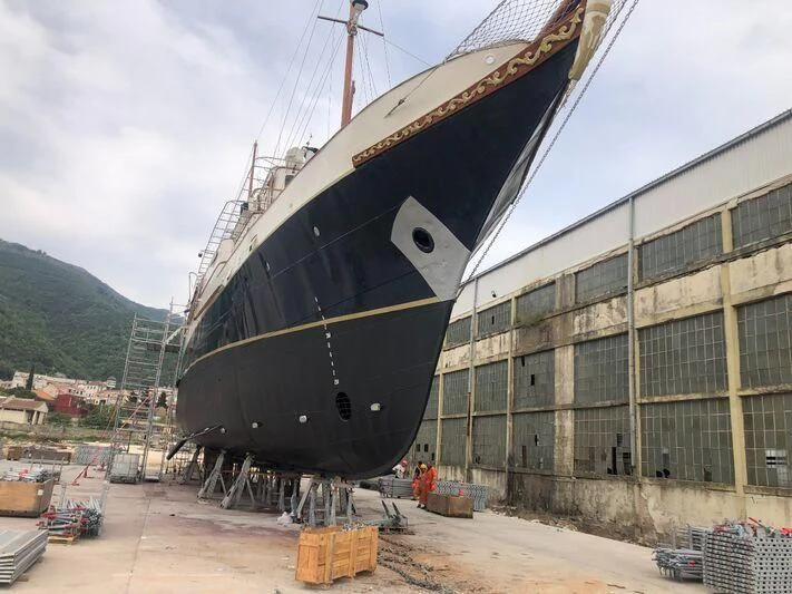 a large ship in a harbor aboard KALIZMA Yacht for Sale