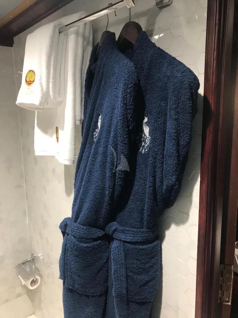 a blue coat on a swinger aboard KALIZMA Yacht for Sale