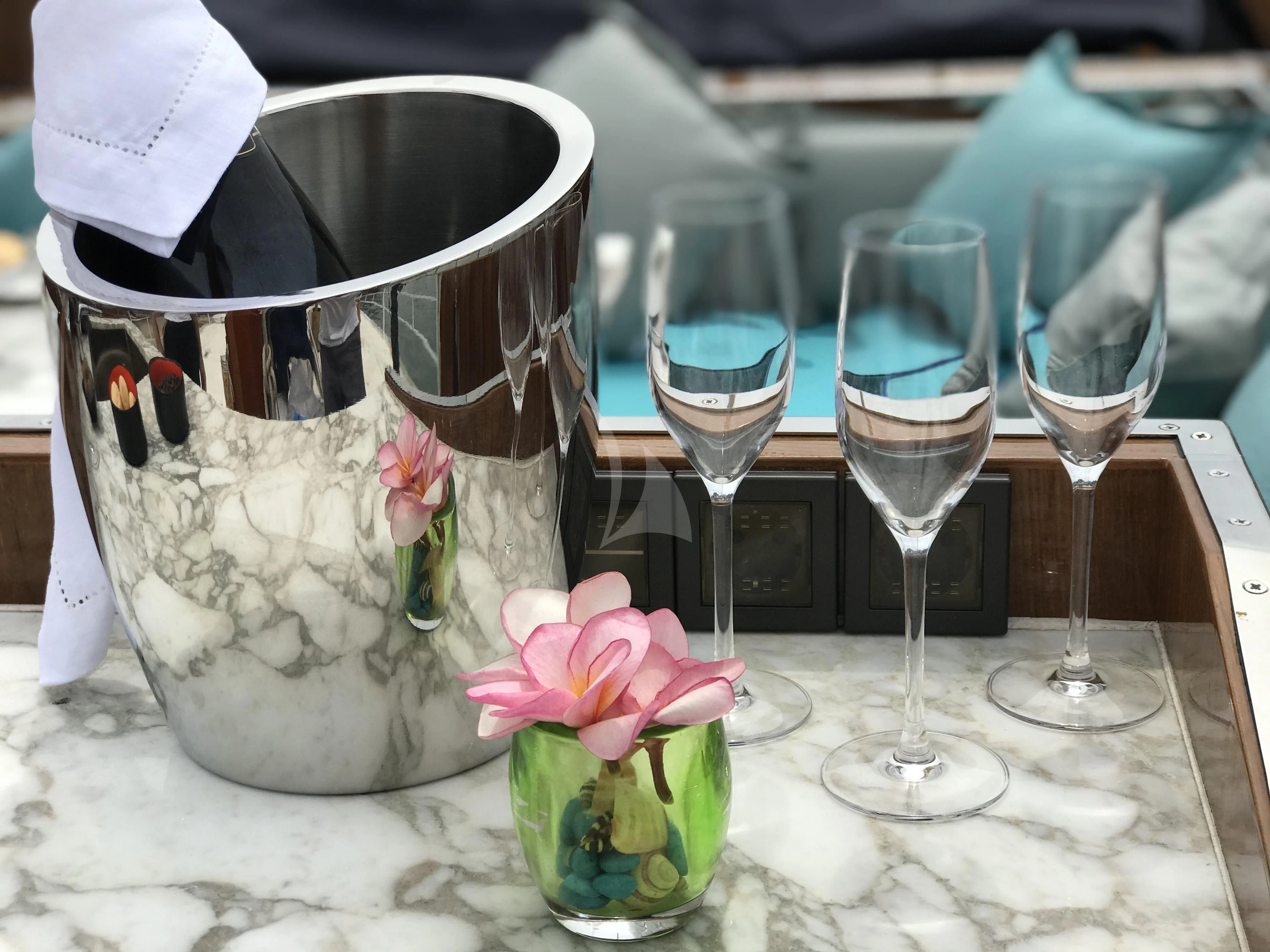 a group of glasses with flowers in them aboard KALIZMA Yacht for Sale