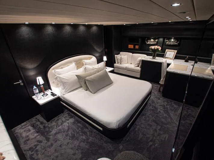 a room with a bed and a desk aboard SEA SQUIRTER Yacht for Sale