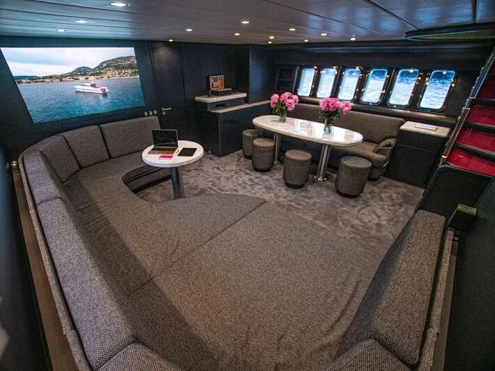 a couch and table in a room aboard SEA SQUIRTER Yacht for Sale