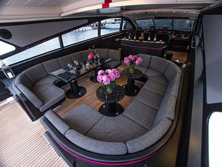a room with a couch and coffee table aboard SEA SQUIRTER Yacht for Sale