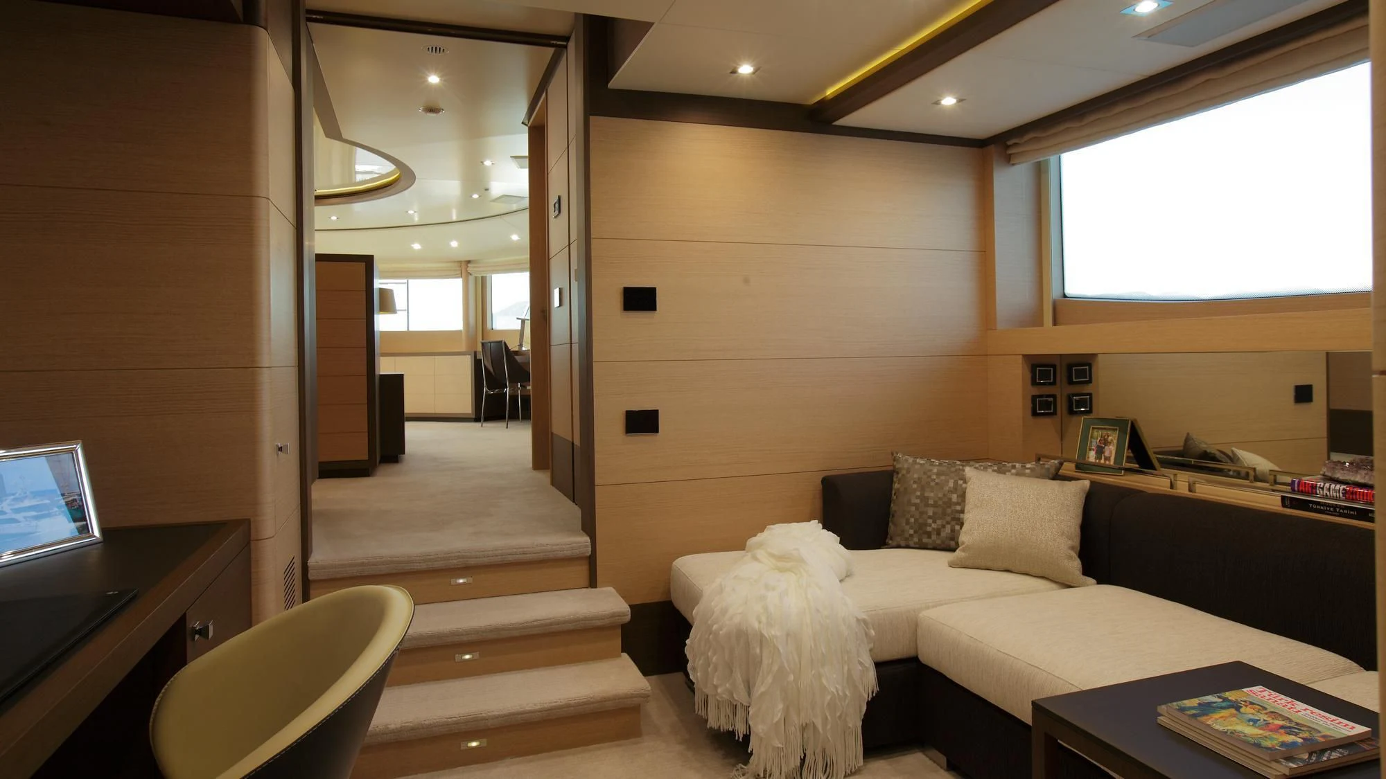 a living room with a white couch aboard LATIKO Yacht for Charter