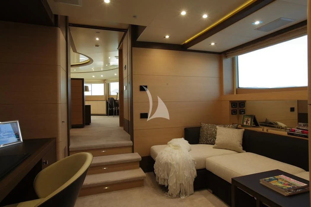 a living room with a couch and a television aboard LATIKO Yacht for Charter