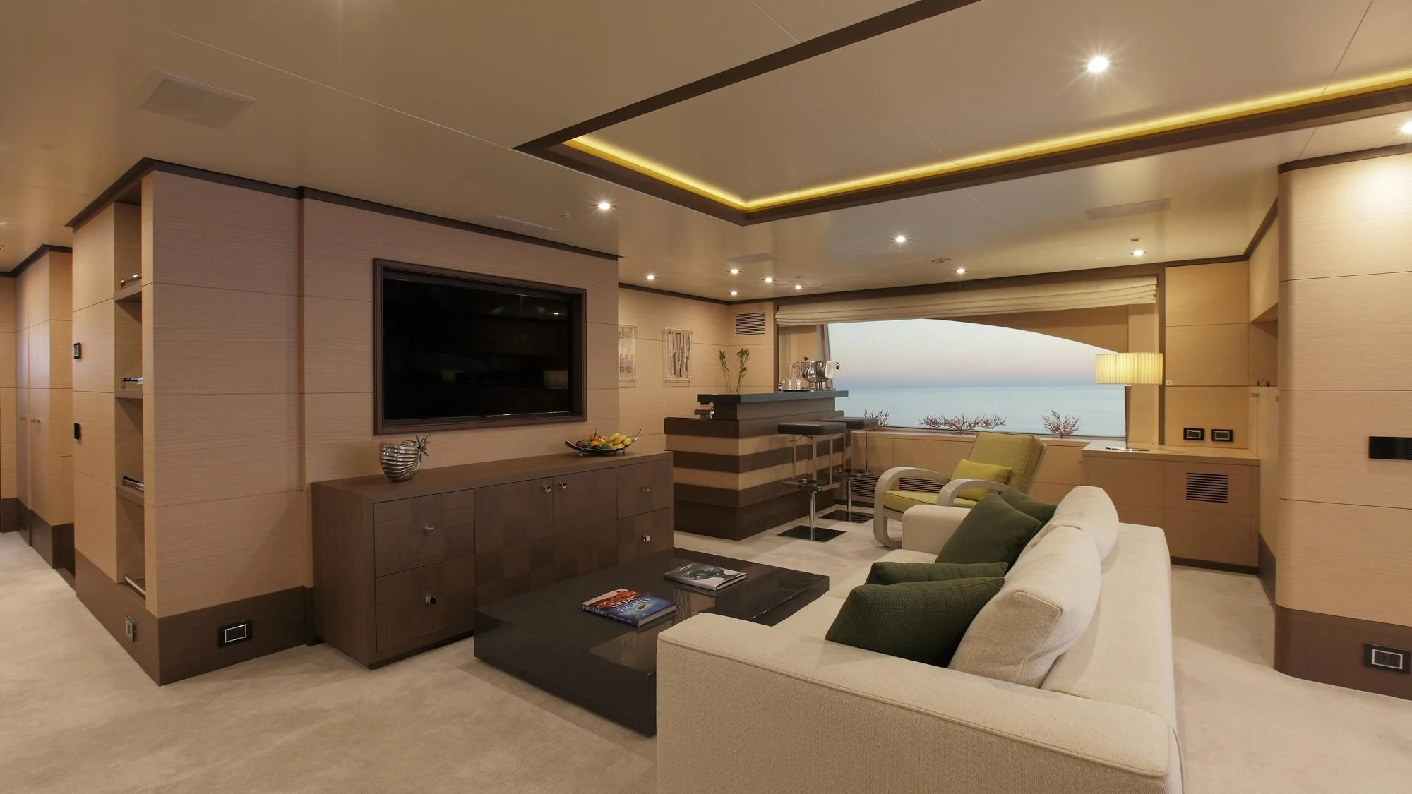 a living room with a large tv aboard LATIKO Yacht for Charter
