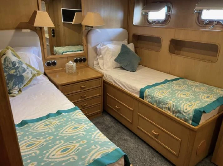 a couple of beds in a hotel room aboard ATLANTIC LADY Yacht for Sale