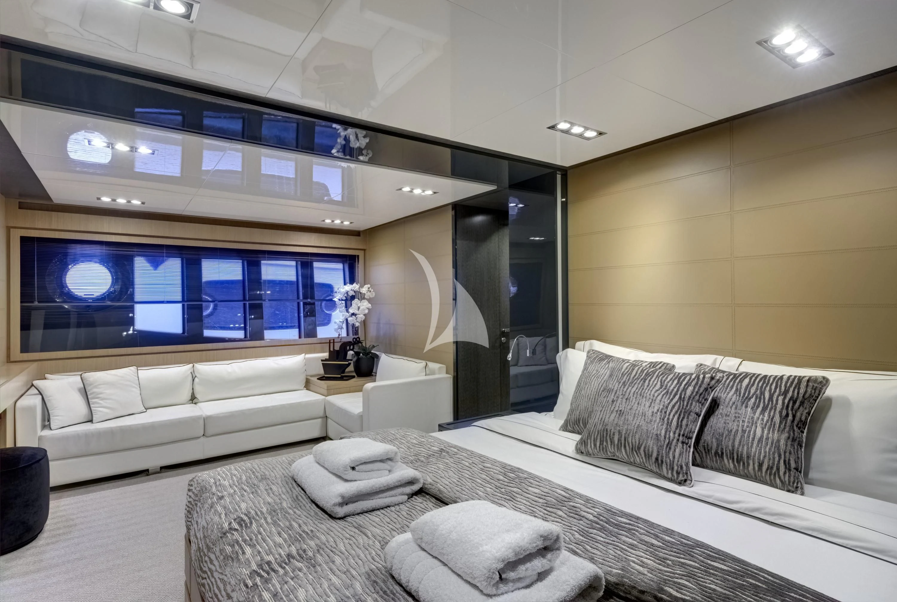 a room with a couch and a tv aboard WHATEVER Yacht for Charter