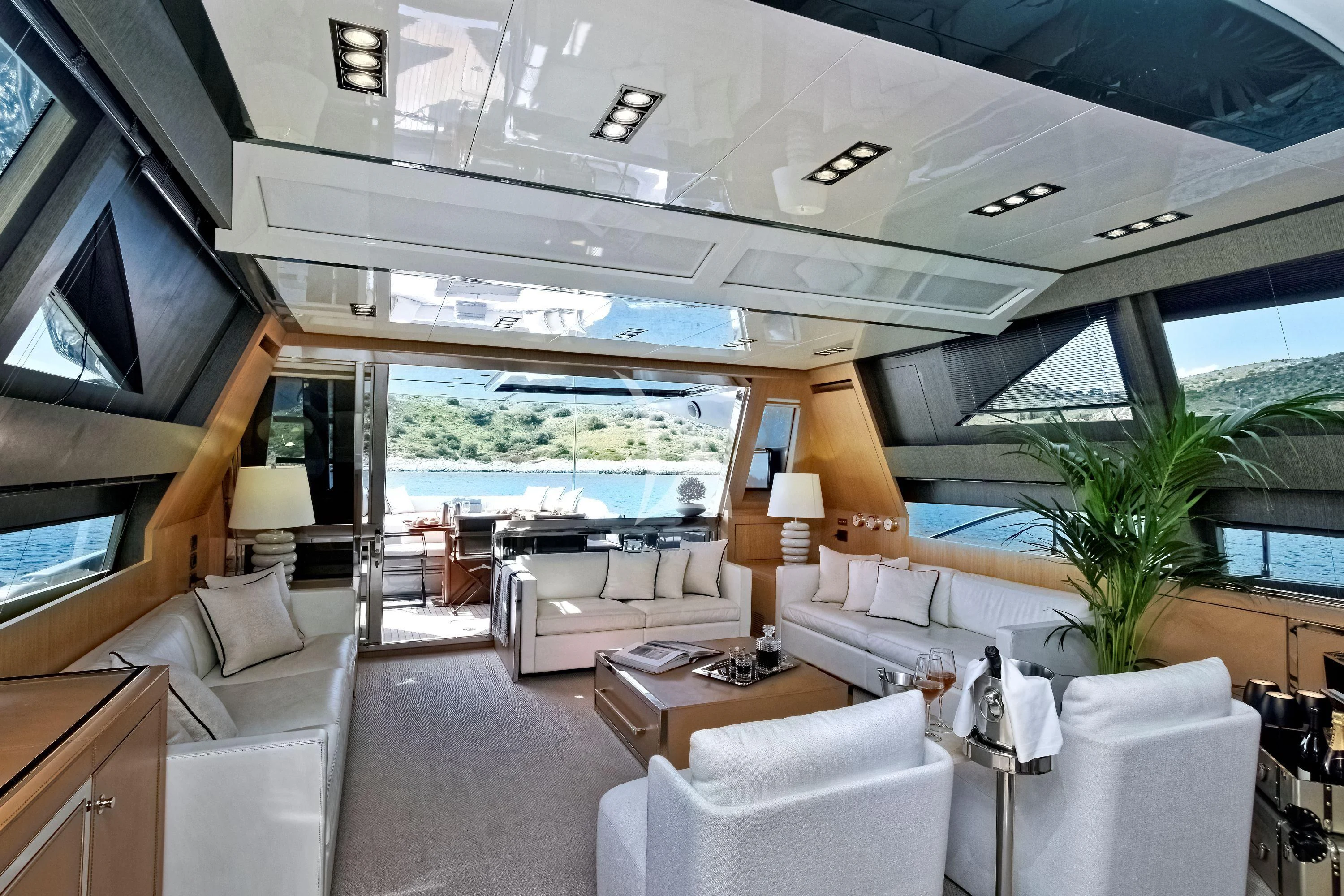 a room with a large window and a view of the ocean aboard WHATEVER Yacht for Charter