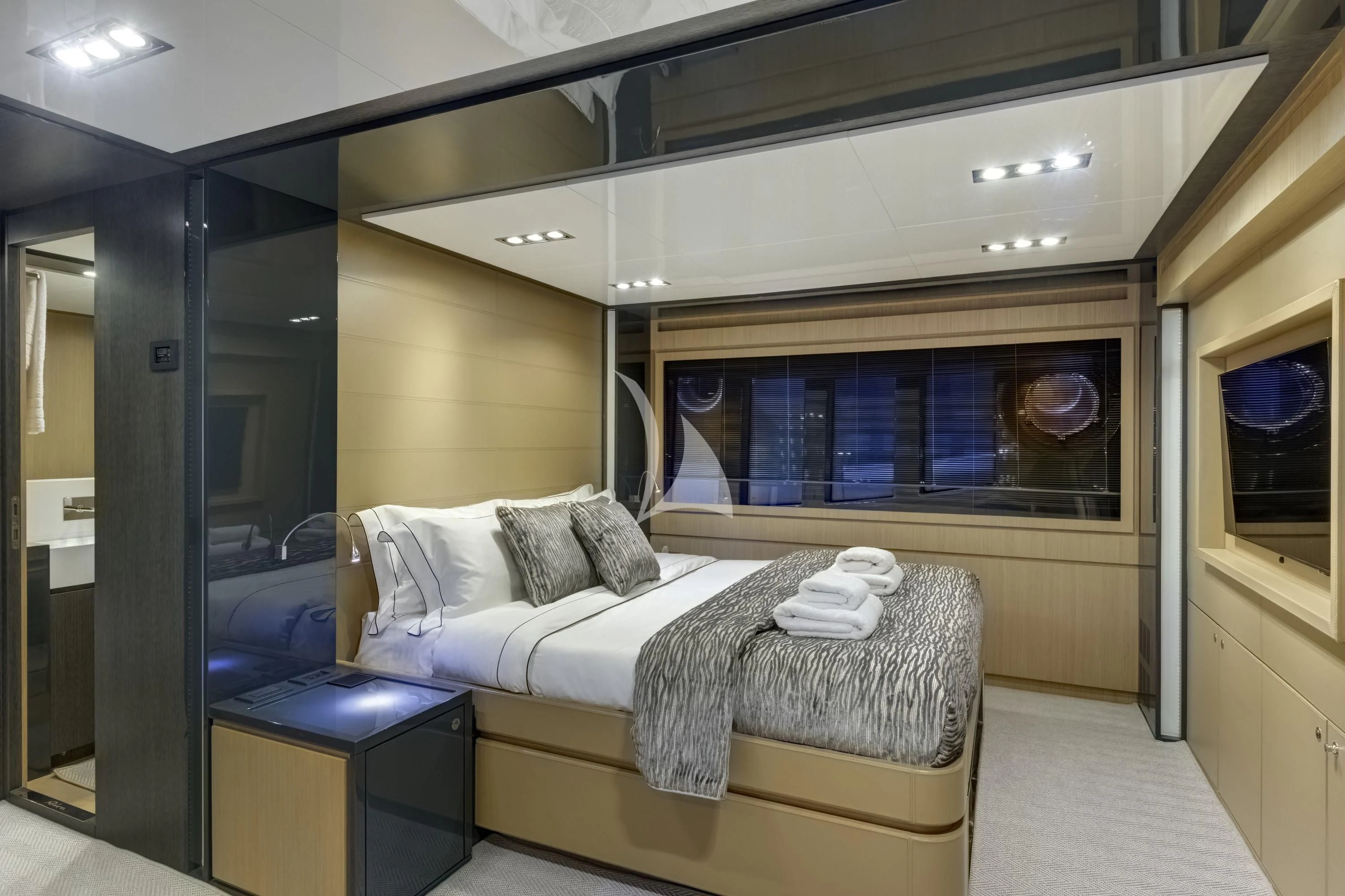 a room with a bed and a window aboard WHATEVER Yacht for Charter