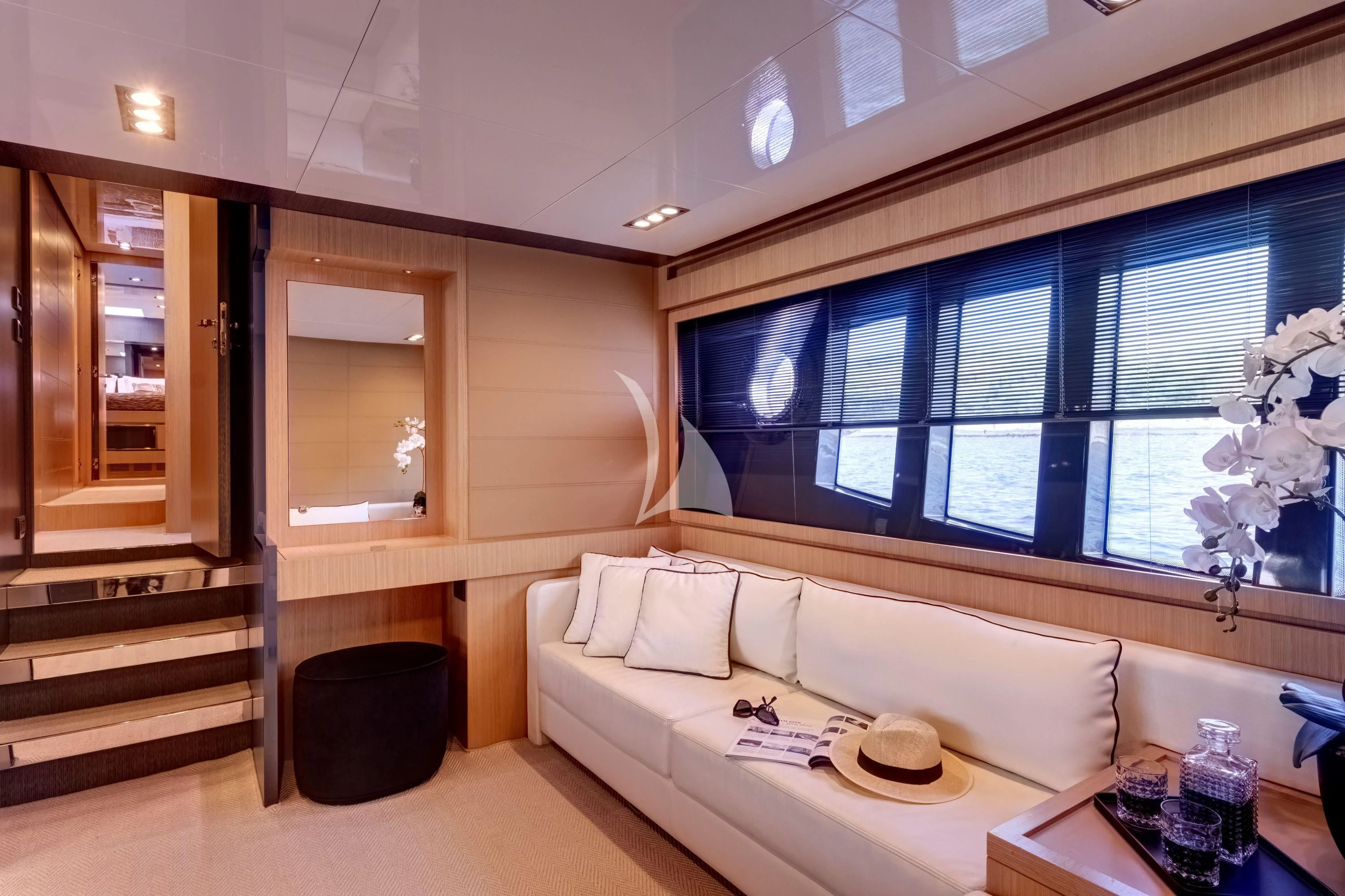 a room with a couch and a chair aboard WHATEVER Yacht for Charter