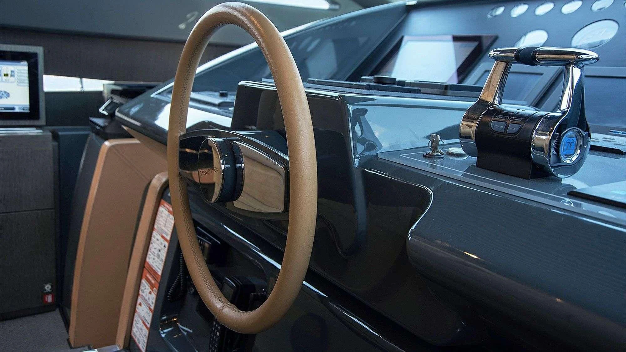 a car with a large wheel aboard WHATEVER Yacht for Charter