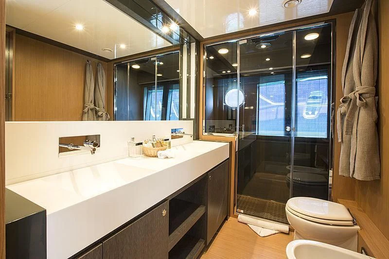 a bathroom with a large mirror aboard WHATEVER Yacht for Charter