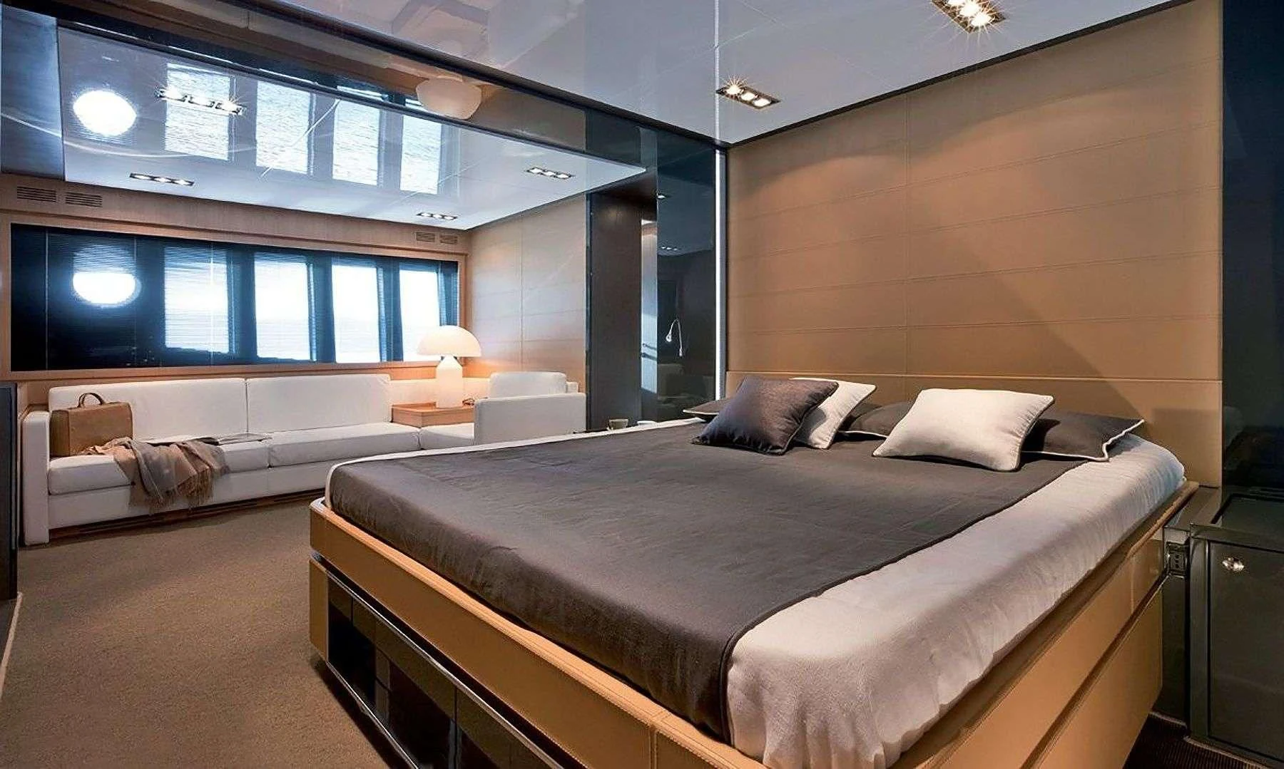 a room with a bed and a tv aboard WHATEVER Yacht for Charter