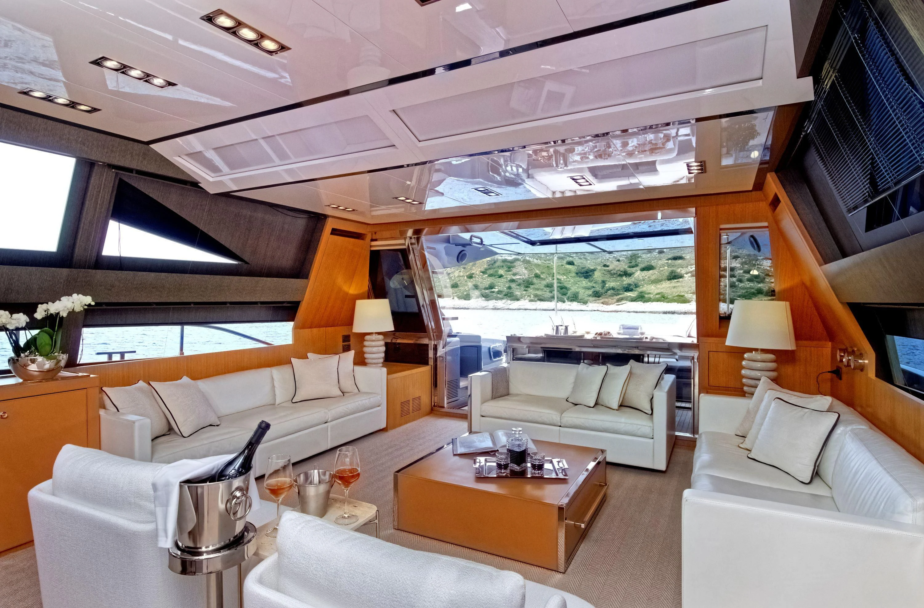a living room with a large window aboard WHATEVER Yacht for Charter