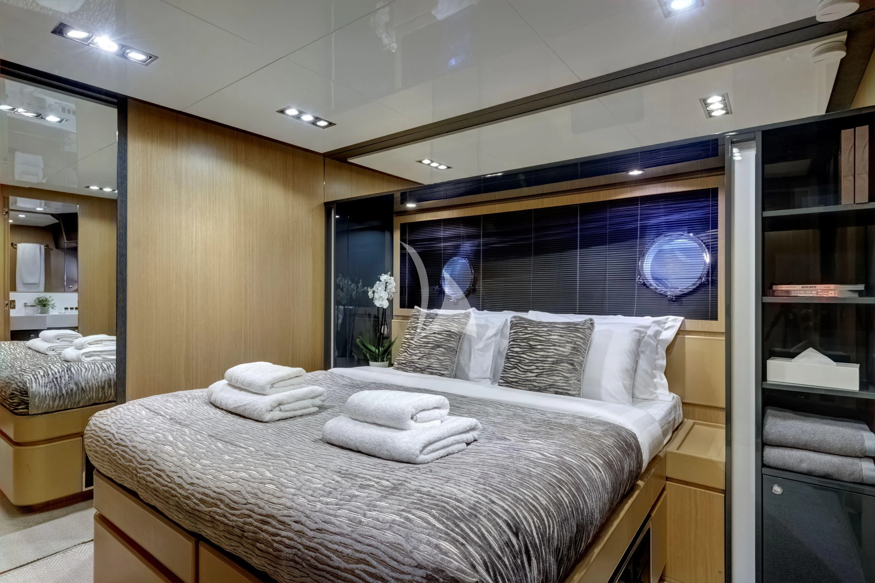a bed with white sheets aboard WHATEVER Yacht for Charter