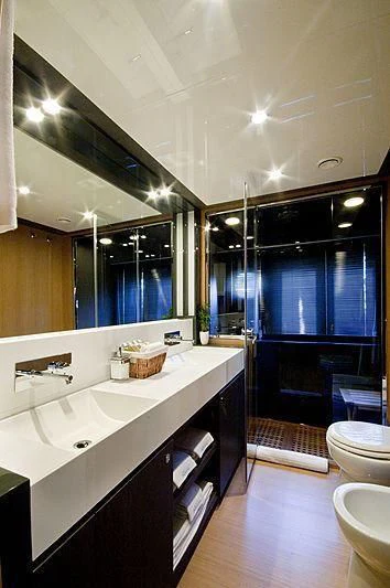 a bathroom with a large mirror aboard WHATEVER Yacht for Charter