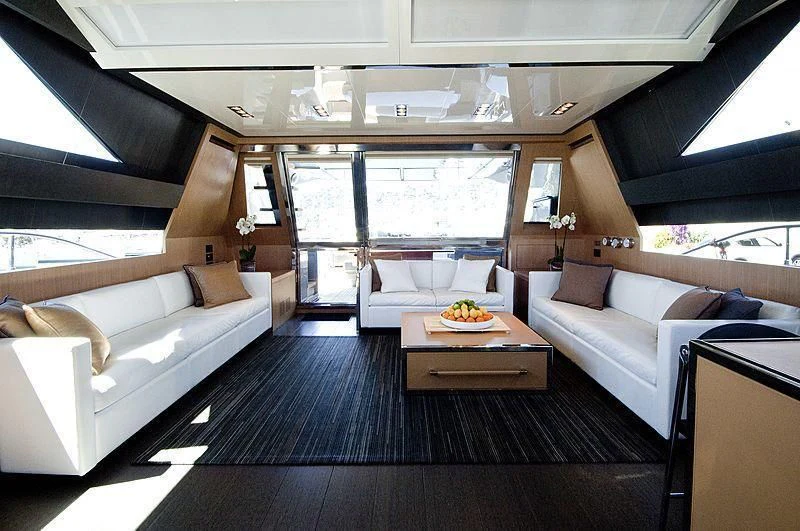 a living room with a couch and a table aboard WHATEVER Yacht for Charter