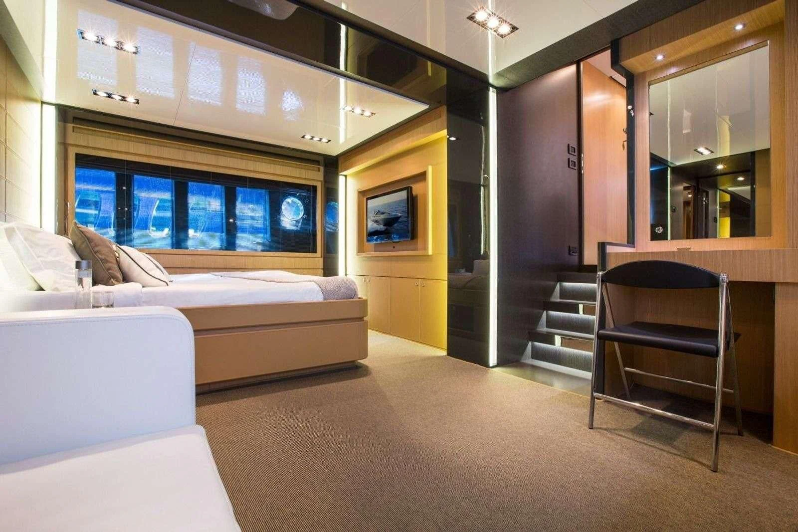a room with a couch and a chair aboard WHATEVER Yacht for Charter
