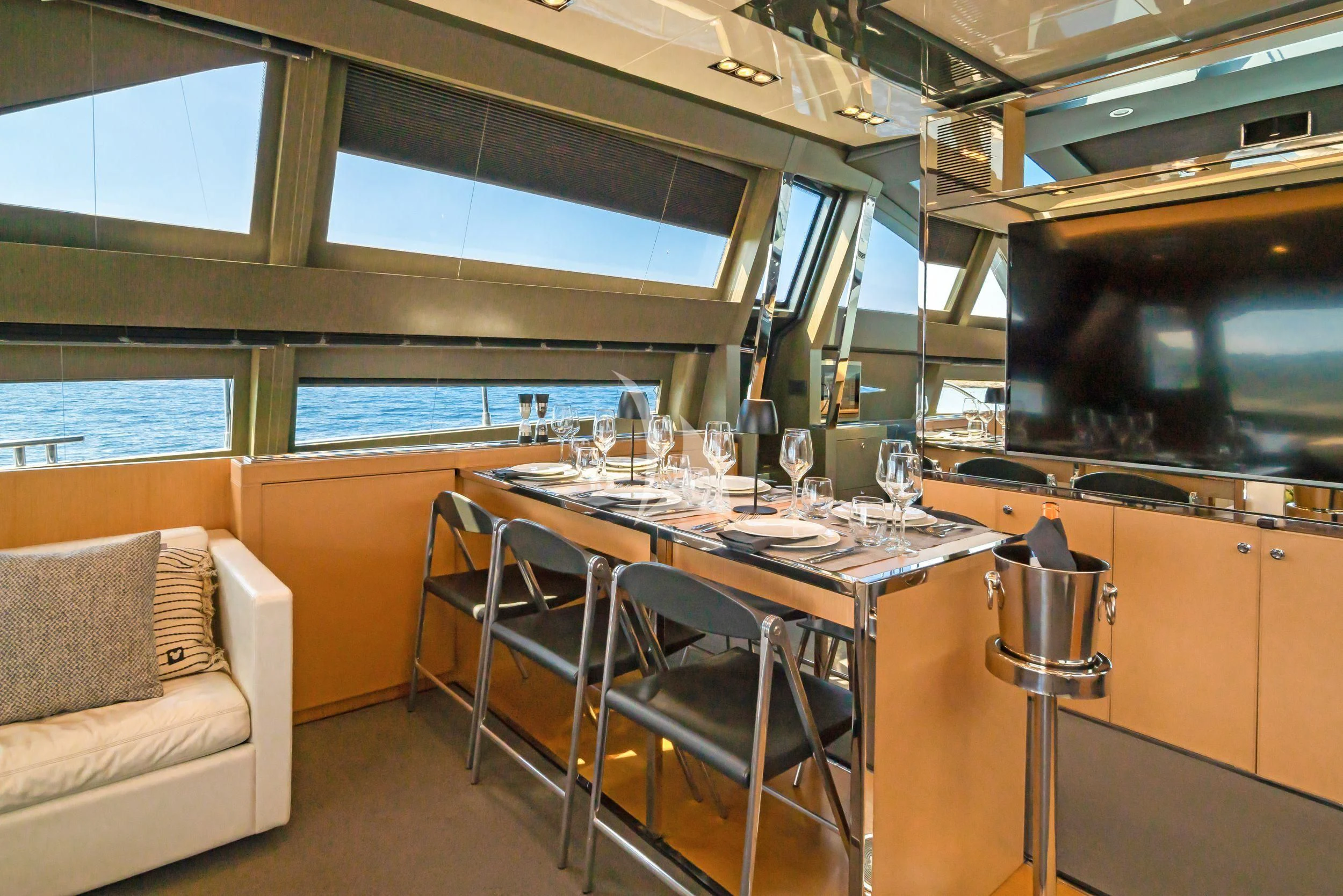 a dining table in a room aboard WHATEVER Yacht for Charter