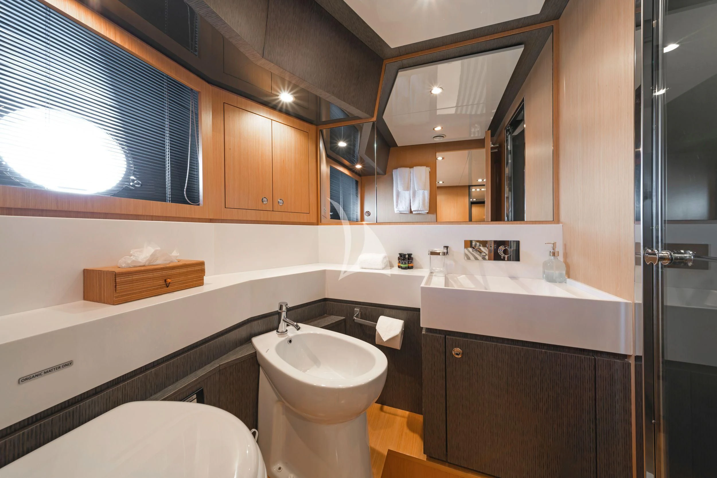 a bathroom with a sink and a toilet aboard WHATEVER Yacht for Charter